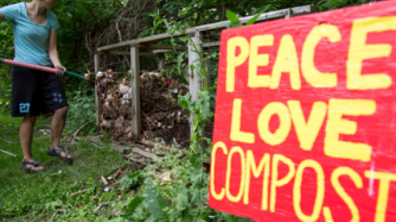 Sign says "peace love compost" in the student garden