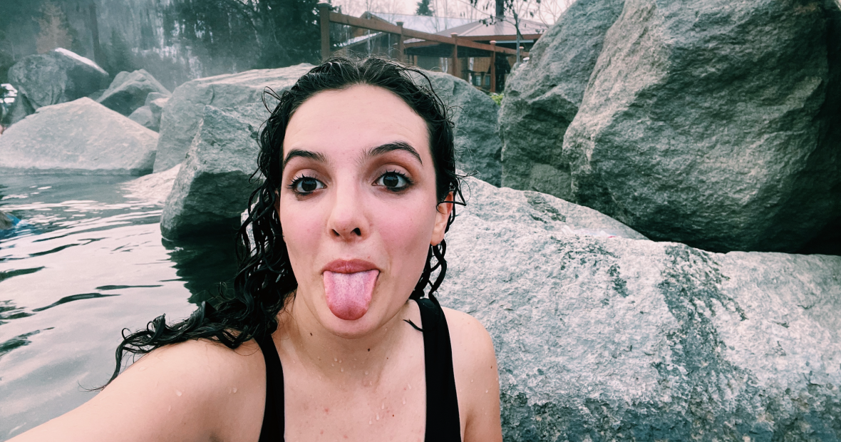 Antonella Diaz sticks her tongue out in front of the cold waters of Alaska