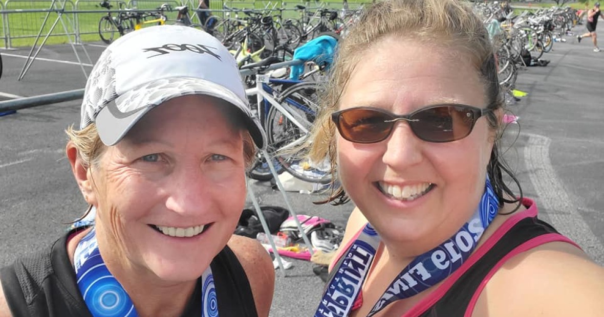 Rachel Bly, right, with friend Cat Campbell Currier after one of the 26 sprint triathlons they completed toward their goal of finishing one in every state.