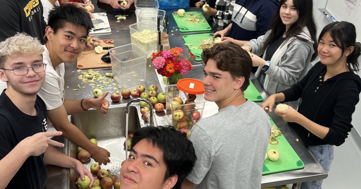 Student at the apple theme food stories at the Global Kitchen