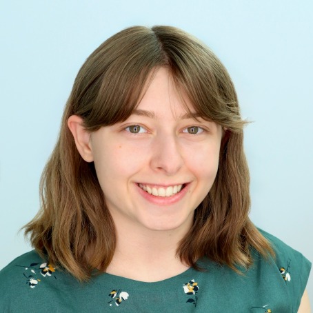 A student smiles for a headshot