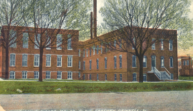 Old colored postcard view of the glove factory building in Grinnell