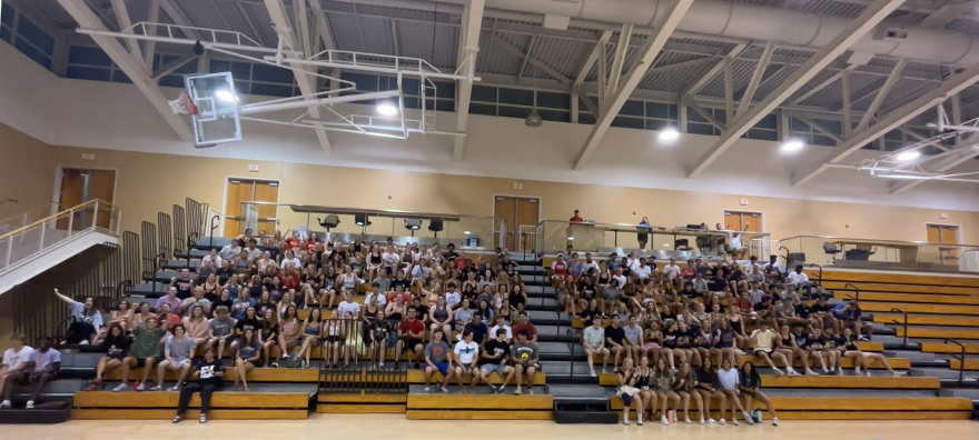 People fill the bleachers in Darby Gym