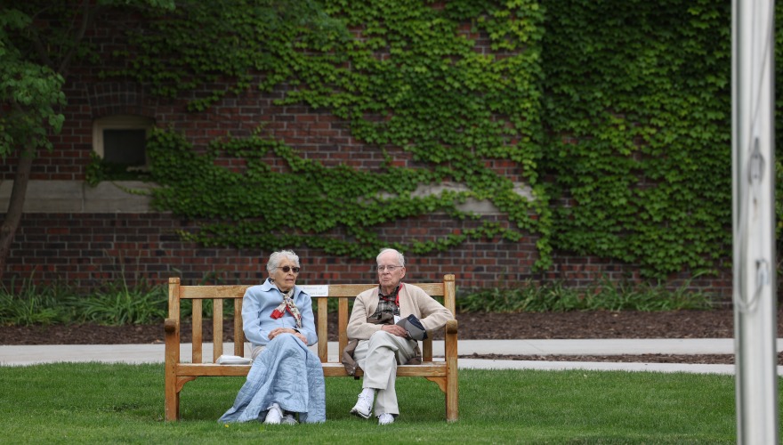 Older couple sitting on bench 