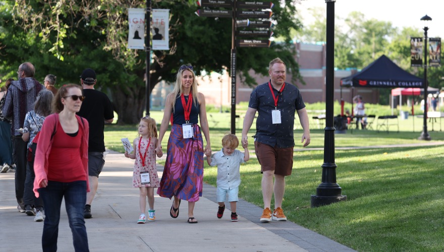 Family walking on campus