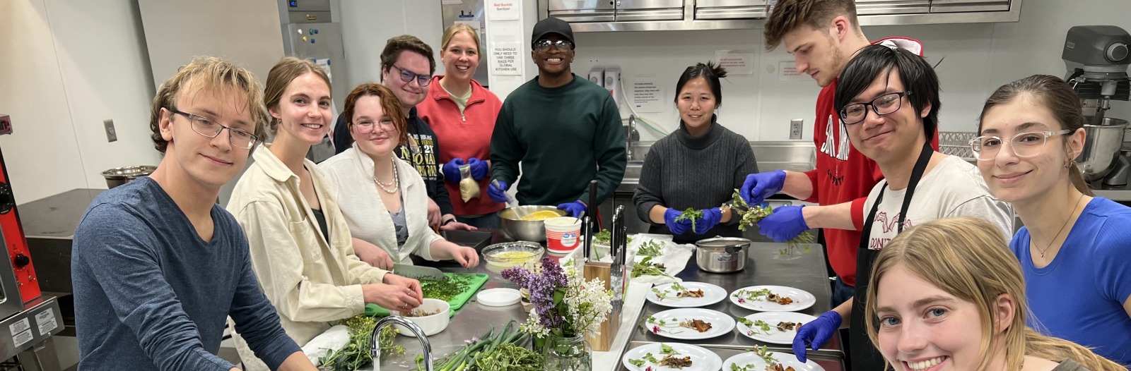 Students making food during a class at the Global Kitchen