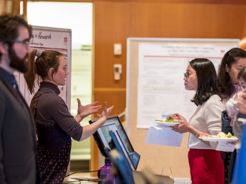 Attendees explore exhibits at the Digital Liberal Arts Teaching Fair