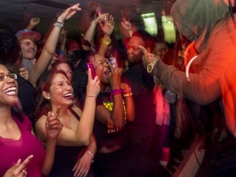 Students dance at a concert in Gardner Lounge