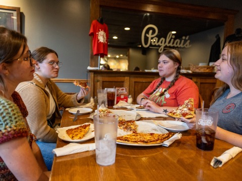 4 students having pizza