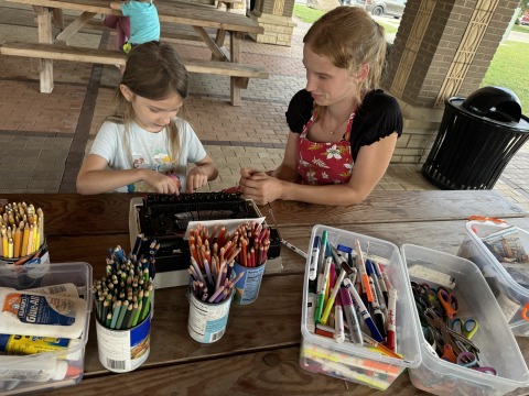 two people working on a art project