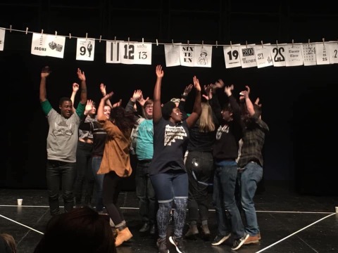 The Neo-Futurist Theatre Group in a prior performance of The Infinite Wrench at Grinnell College. 