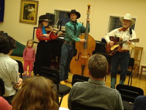 The Double D Wranglers—(from left) Charity Gudgel , Chris Gudgel, and Paul Siebert—demonstrate cowboy yodeling at the yodeling workshop on Nov. 13, 2009.