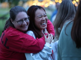 Two women hugging at reunion 