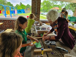 Tilly working with students on art project 