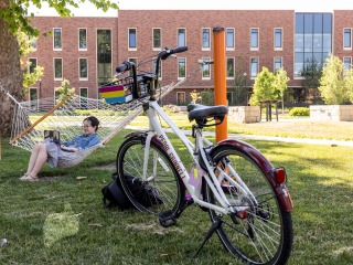 Girl in hammock with bike in the photo