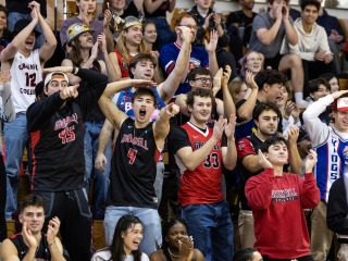 students cheering at a basketball game