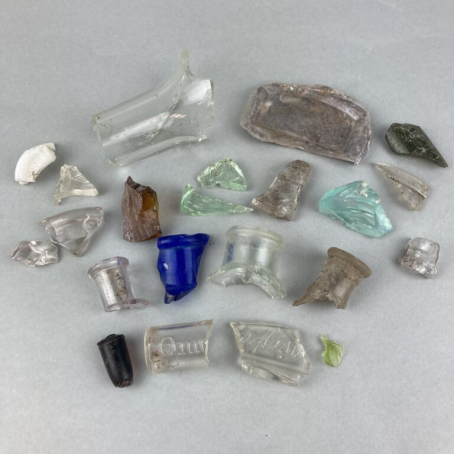 A collection of glass shards and other artifacts found in Grinnell