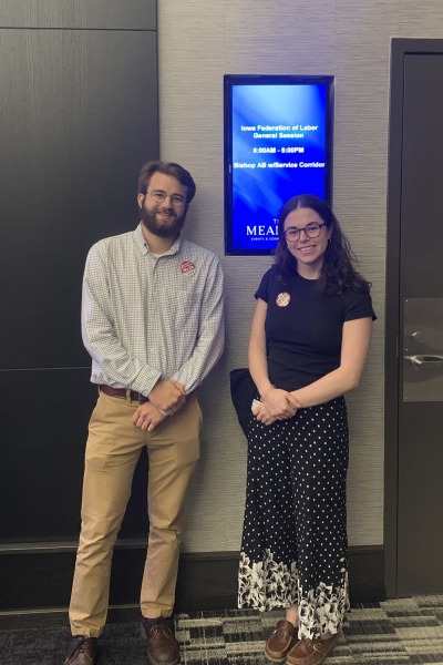 A young woman and a man at a conference